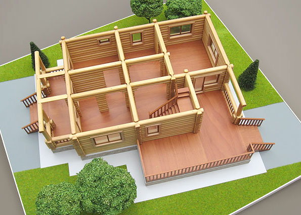 Планировка первого этажа деревянного коттеджа на макете.